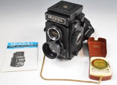 Seagull WWSC-120 TLR camera with owner's manual and a Zeiss Ikon meter