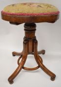 Thonet bentwood adjustable piano stool raised on four legs