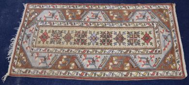 Turkoman rug with central rectangular panel with nine guls, 214 x 113cm
