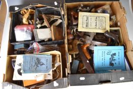 Large collection of woodworking plane parts including Record 050C and 044, cutters, bodies,