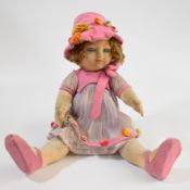 Chad Valley felt covered 'Bambina' doll with blue glass eyes, pink lips and pink clothing, 1920/30'