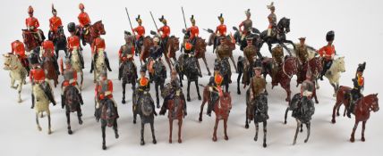 A collection of Britains mounted soldiers including Lancer Regiment, Houshold Cavalry and
