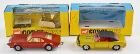 Two Corgi diecast model vehicles Oldsmobile Toronado with maroon body, cream interior and cast