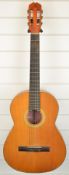 Classical acoustic guitar labelled 'BM Sevilla'