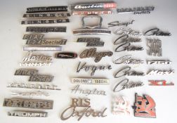 Large collection of car badges including multiple (Ford) Cortina, Allegro, Vanguard, Jaguar,