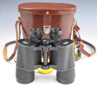 Pair of Carl Zeiss Jenoptem 7x50W binoculars, in original leather case with various 1980s horse