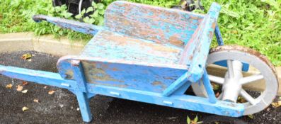 Vintage wooden wheelbarrow, suit shop display or similar