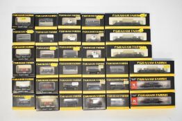 Thirty-three Graham Farish N gauge model railway wagons including SR Queen Mary brake vans and GWR