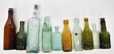 Vintage bottles including Warn & Sons Tetbury, Arnold Perrett, Flag Sauce, Stroud Brewery, Bown & Co