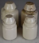 Four GWR and GPO telegraph line insulators, one with tag suggesting it as having been from