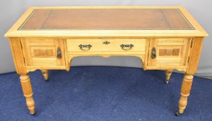 Late 19th or early 20thC oak leather inset desk, fitted single drawer flanked by cupboards, raised