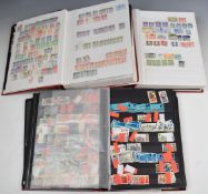 A collection of GB and world stamps in various albums and folders including France, USA, Belgium