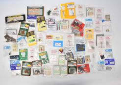 Collection of N gauge model railway accessories including figures, animals and accessories