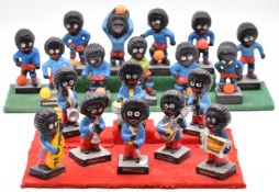 Nineteen Robertson's Jam Golly advertising figures comprising eight band members and eleven