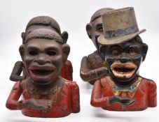 Four cast iron novelty money boxes, height 19cm