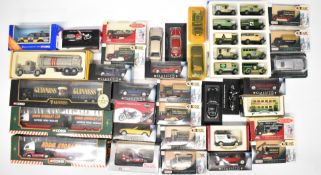 Over thirty diecast model sports cars, motorcycles, haulage and commercial vehicles, manufacturers