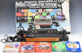 Atari CX2600 video computer system together with joysticks, paddle controllers, power supply and