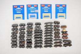 Fifty-five Peco GWR, SR, LNER and LMS N gauge model railway open wagons, some in original boxes.