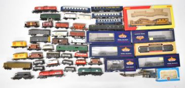 A collection of 00 gauge passenger carriages and rolling stock to include Hornby, Bachmann and