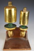 Mounted pair of GWR steam railway locomotive whistles, height of stand 34cm