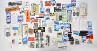 Collection of N gauge model railway rolling stock kits and parts, including Peco, Parkside Dundas