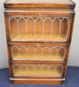 Globe Wernicke style three section bookcase with leaded glass fronts, W84 x D30 x H124cm