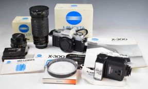 Minolta x-300 35mm SLR camera with Minolta 50mm 1:1.7 and Sirius 1:40-5.6 2.8-200mm lenses, with