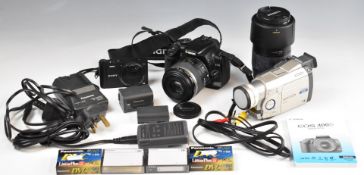 Three digital cameras comprising Canon EOS 400D digital SLR camera with 60mm 1:2.8 EFS Canon Macro