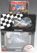 Three diecast model motorbikes by Minichamps, Guiloy and Maisto, all in original boxes.