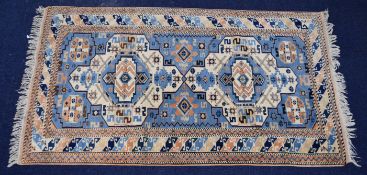 Vintage Turkoman rug with central oblong gul on a wine ground, 200 x 122cm