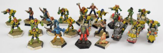 Twenty-six Games Workshop Judge Dredd metal miniatures including various Judges, Rogue Trooper,