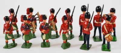 Thirteen Britians soldiers comprising Guardsmen and a kilted regiment.