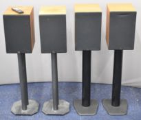 Two pairs of Avi ADM9.1 stereo speakers on tubular stands