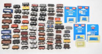 Sixty-eight Peco N gauge model railway wagons including conflat and tanker, some in original boxes.