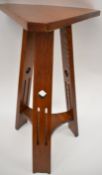 Arts & Crafts oak cricket table with pierced decoration, height 71cm