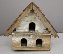 19thC or similar dovecote with shingle roof above three pigeonholes, W55 x D53cm
