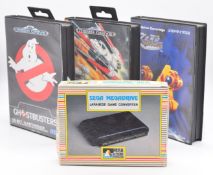 Three Sega Mega Drive game cartridges comprising Ghostbusters, Hellfire and Zero Wing together