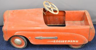 Tri-ang 1950's tin or pressed steel 'Lightning' pedal car with red body, white steering wheel and