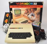 Dragon 32 family computer together with joysticks, manual and a selection of games, all in