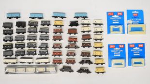 Fifty-nine Peco GWR, SR, LNER and LMS N gauge model railway wagons and break vans, some in