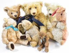 A collection of seven Teddy bears to include a Steiff 2002 Jubilee bear with scarf and button in