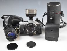 Olympus OM-2N 35mm SLR camera with Olympus 1:1.8 50mm and Tokina 35-105mm 1:3.5-4.3 lenses and an