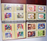 A collection of GB PHQ cards in seven folders and a small box of presentation packs