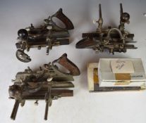 Three Record No. 405 woodworking multi-planes, with various cutters