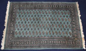 Green ground rug, 165 x 240cm