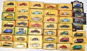 Forty-two Vanguards 1:43 scale diecast model cars to include Red Herald VA5000, Navy Anglia