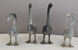 Four cast metal geese / garden ornaments, height 68cm