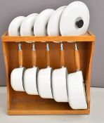 Set of five Le Creuset cast iron graduated saucepans in white, 0.5 to 3 litres, with lids and pine