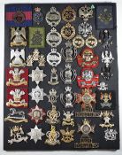Mounted display of approximately 46 British Army metal and anodised Cavalry Regiment badges