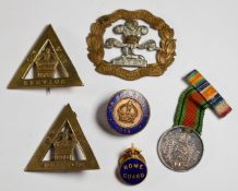Three On War Service badges, a Home Guard badge, South Lancashire Prince of Wales Volunteers bi-